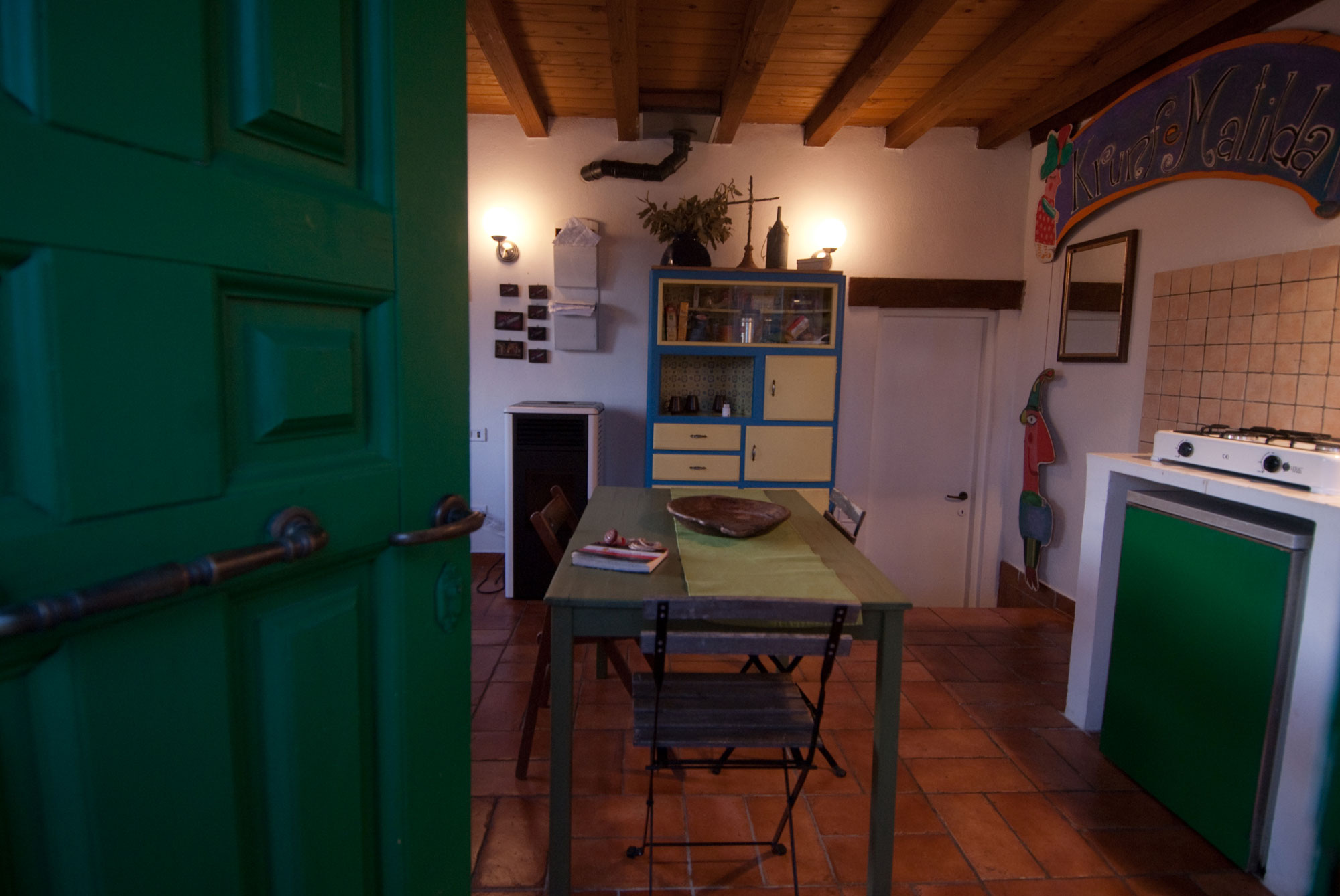 Hostel entrance with equipped kitchen for cooking